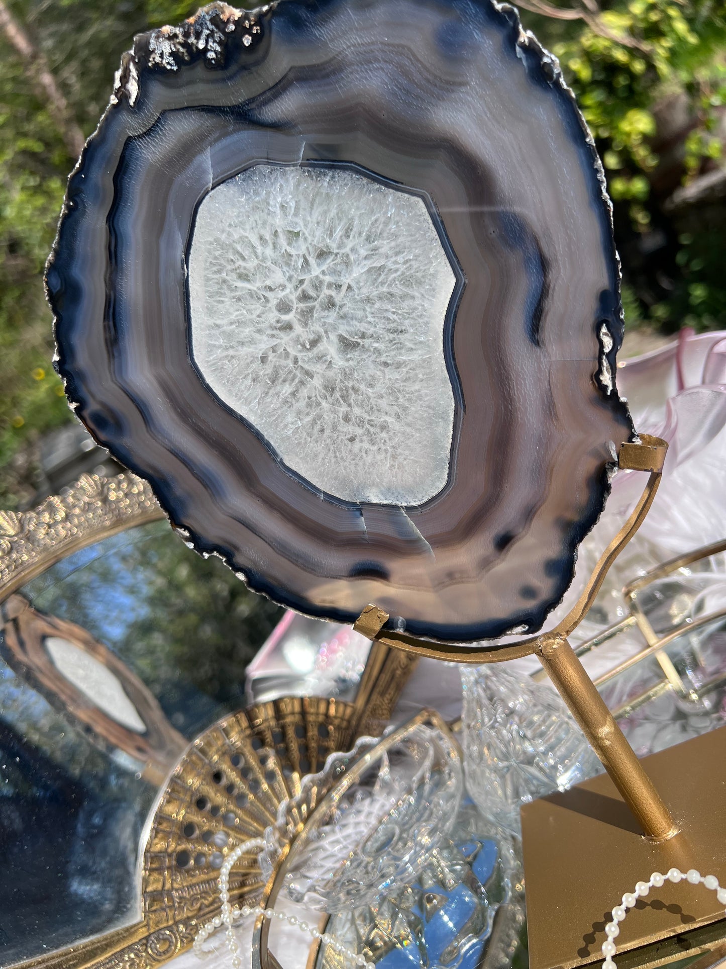 Black Agate portal with clear Quartz centre on Gold Metal stand