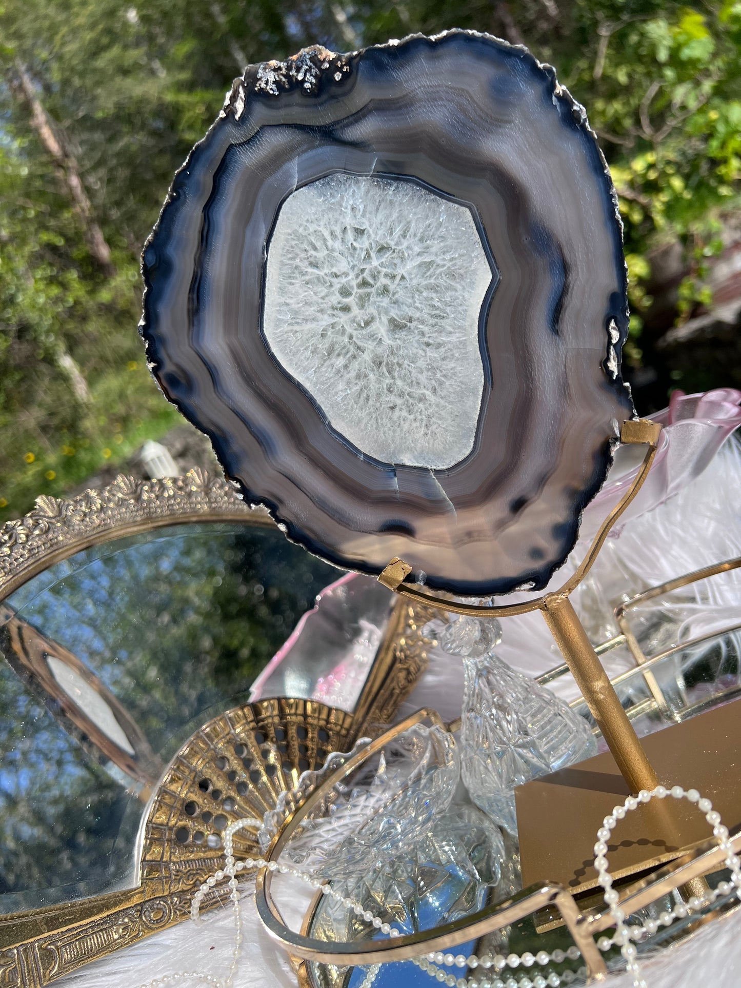 Black Agate portal with clear Quartz centre on Gold Metal stand