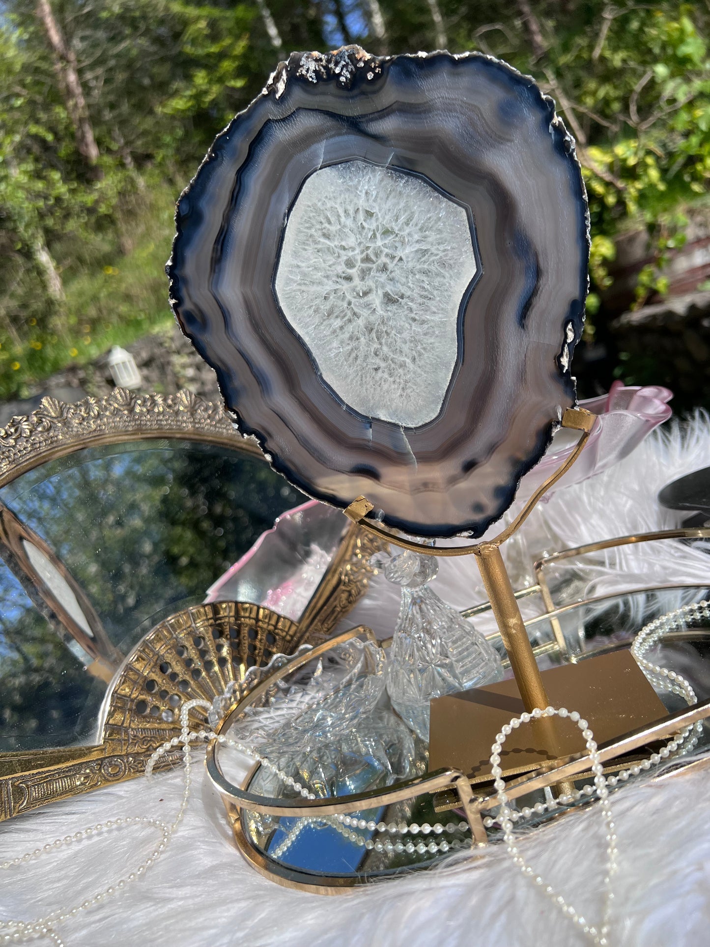 Black Agate portal with clear Quartz centre on Gold Metal stand