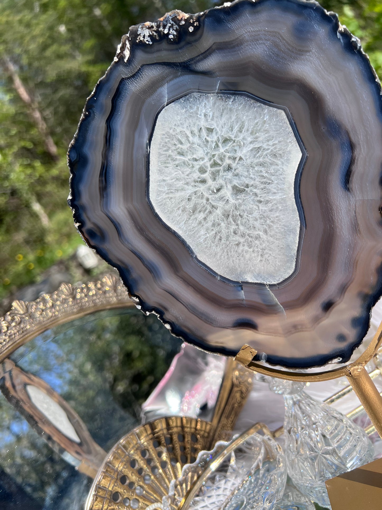 Black Agate portal with clear Quartz centre on Gold Metal stand