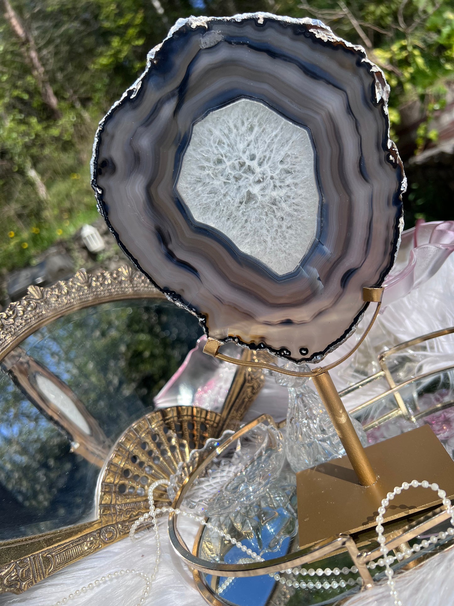 Black Agate portal with clear Quartz centre on Gold Metal stand