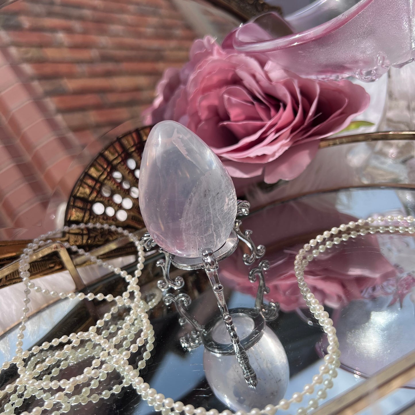 Mozambique Rose Quartz with pyrite inclusions egg carving