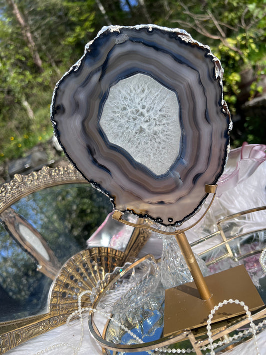 Black Agate portal with clear Quartz centre on Gold Metal stand