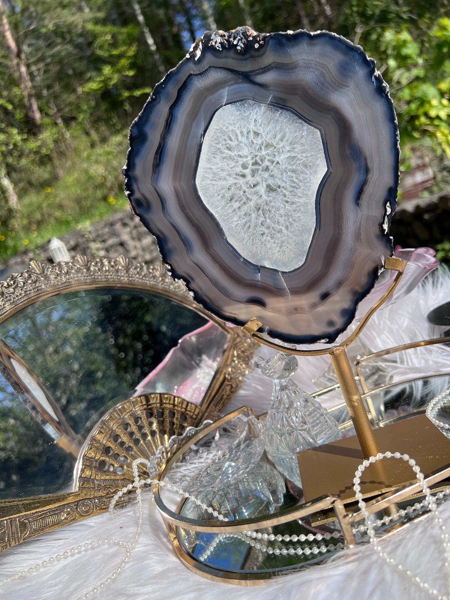 Black Agate portal with clear Quartz centre on Gold Metal stand