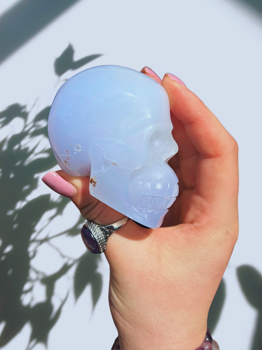 Blue chalcedony skull with denitric inclusions hand crafted carving