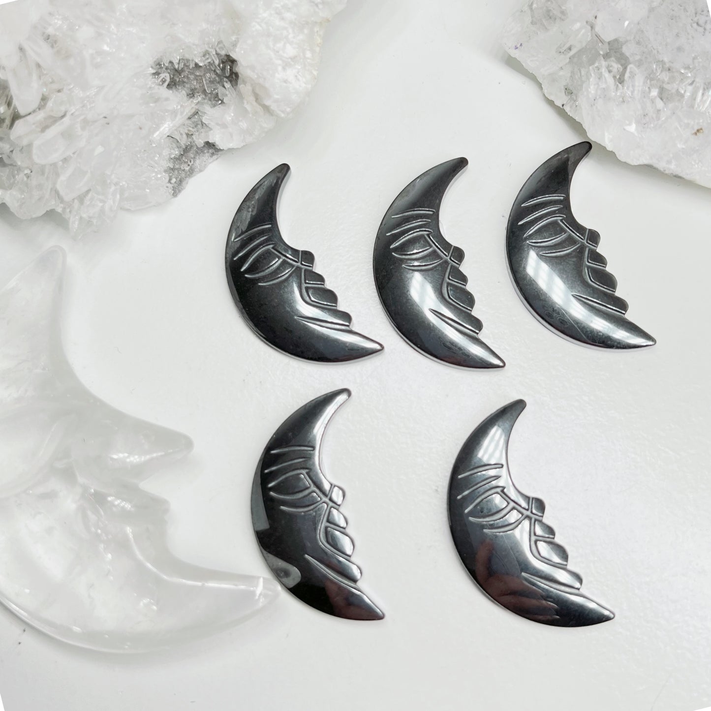 Hematite moon face carving